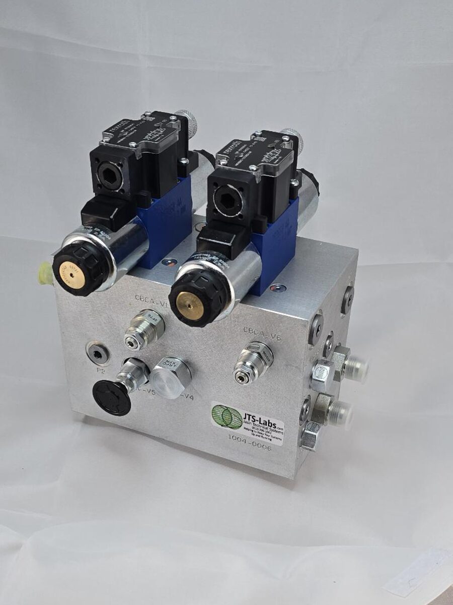 Dual cylinder valve manifold: aluminum block with two Rexroth directional valves mounted on top